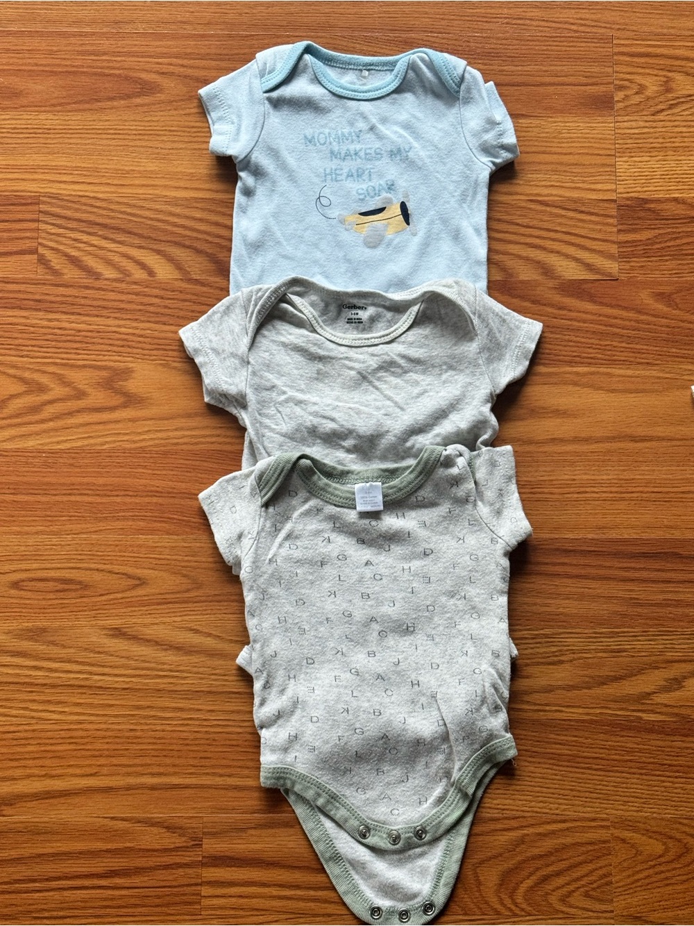 Three Baby Onesies in Light Blue and Heather Gray